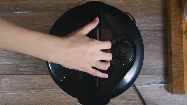 Chicken Breast Being Removed From Multicooker