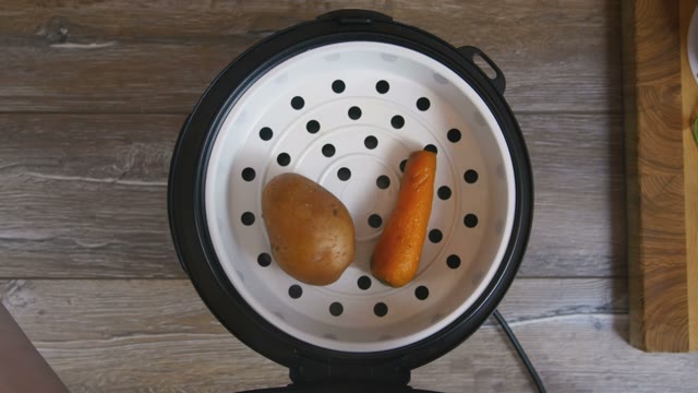 Potato And Carrot Laid Out On A Plate From Multicooker