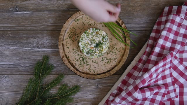 Female Hand Decorated Salad With Pomegranate