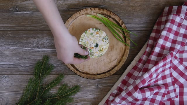 Female Hand Decorated Salad With Dill