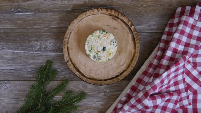 Female Hand Decorated Salad With A Sprig Of Green Onion