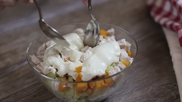 Female Hand Mixed Salad Close-up