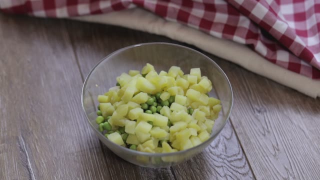 Cook Adds Carrot Slices To A Salad Close-up