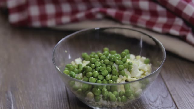Cook Adds Slices Of Potatoes To The Salad Close-up