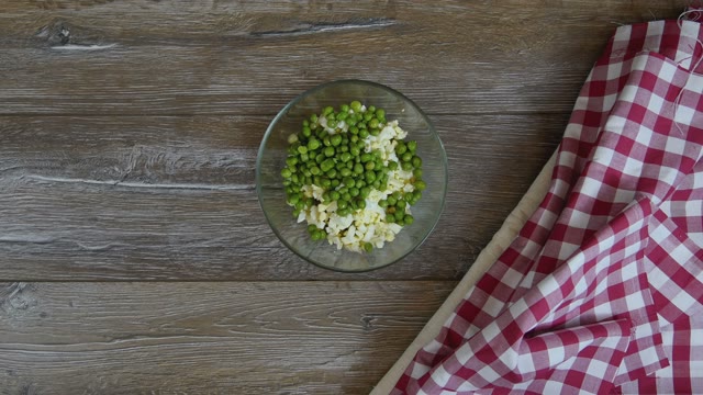 Cook Adds Slices Of Potatoes To The Salad