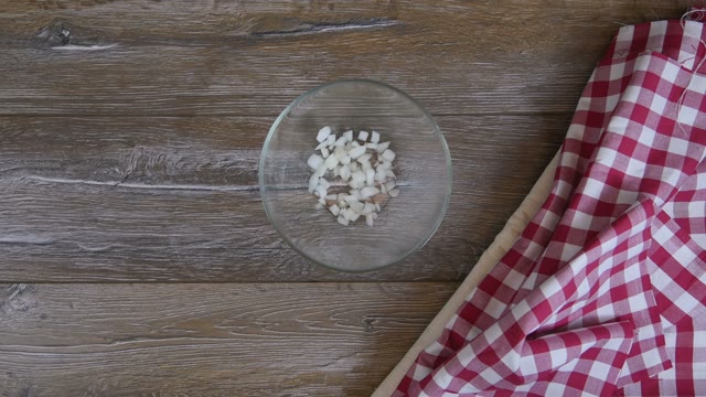 Cook Adds Cucumber To A Salad