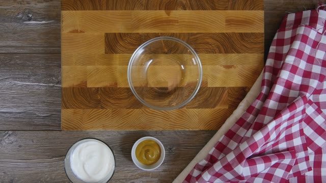 Cook Stirs The Sauce In A Glass Bowl