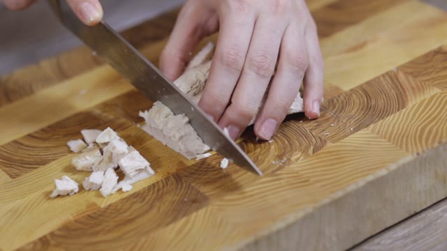 Female Hands Sliced Chicken Breast Close-up