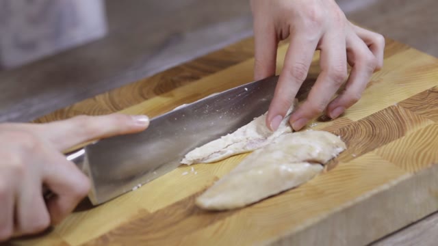 Female Hands Sliced Chicken Breast Close-up