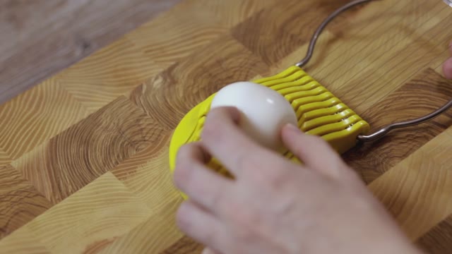 Cutting Eggs Of Egg Slicer Close-up