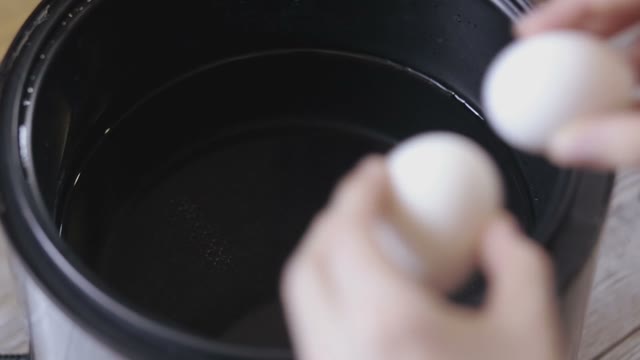 Immersing Eggs In Water Close-up
