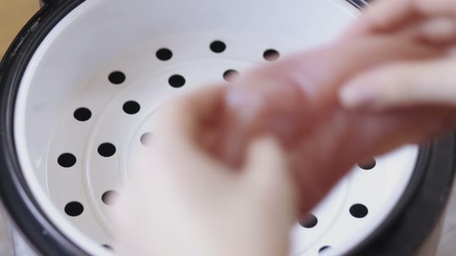 Crude Chicken Breasts Are Placed In Multicooker Close-up