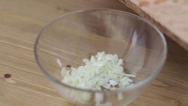Cook Adds Cucumber To A Salad Close-up