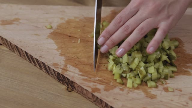 Women Hands Sliced Pickled Cucumbers Close-up