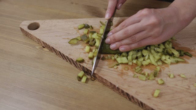 Women Hands Sliced Pickled Cucumbers Close-up