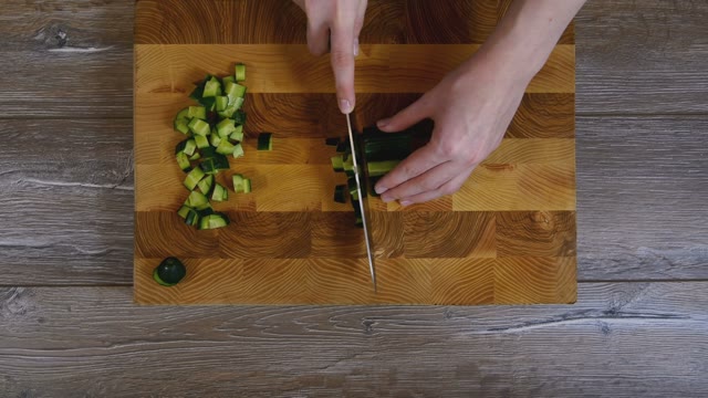 Female Hands Sliced Cucumber