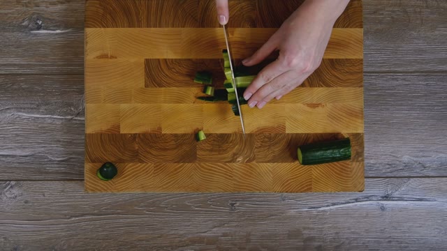 Female Hands Sliced Cucumber
