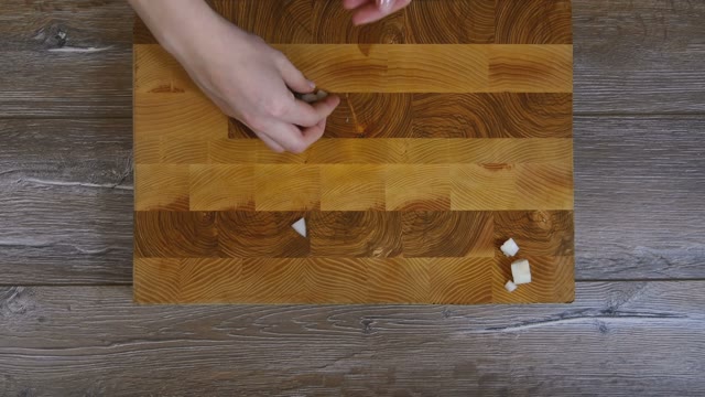 Female Hands Removed From The Board Pieces Of Onion