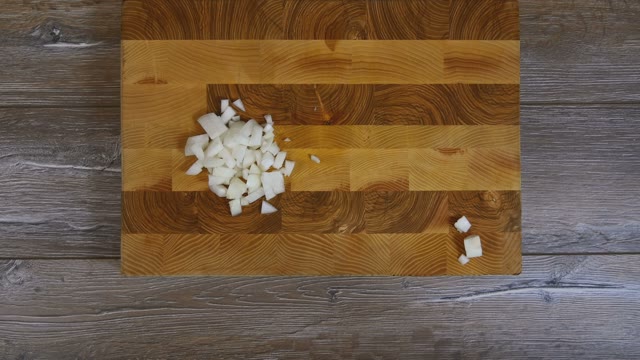 Female Hands Removed From The Board Pieces Of Onion