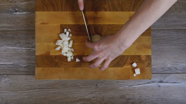 Onions Sliced Into Pieces With A Knife