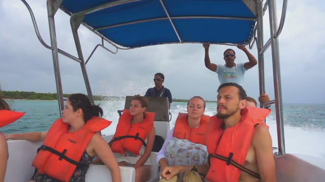 The Tourists On A Boat Floating On The Ocean