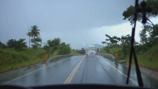 The View From The Car Window With Wipers In The Rain On The Roadway