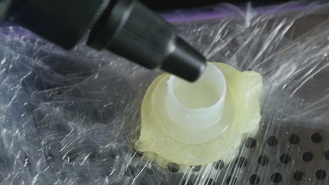 Paint Is Poured Into A Small Container Close-up