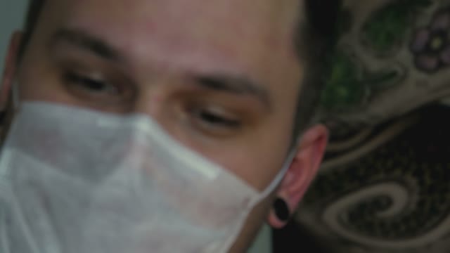 Man's Face In A Mask Close-up