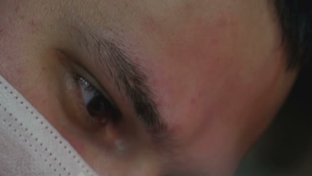 Man's Face In A Mask Close-up