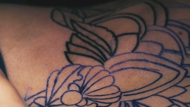 Tattoo Master Rubs The The Tattoo Close-up
