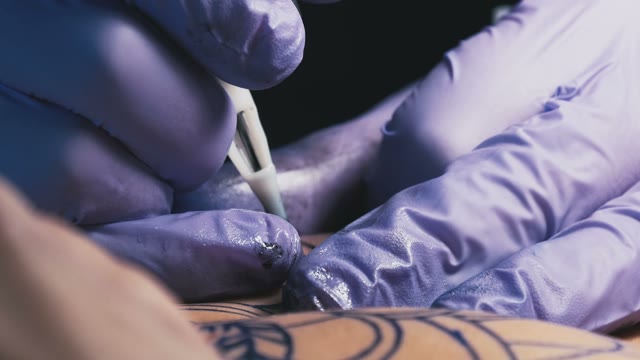 Tattoo Master Makes The Tattoo Close-up