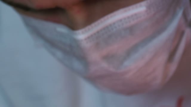 Man's Face In A Mask Close-up