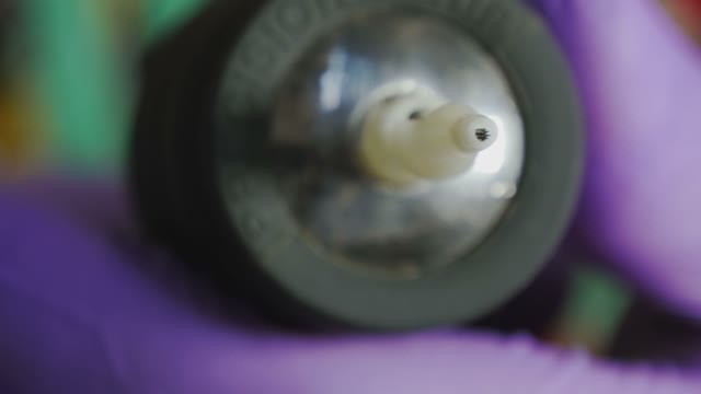 Tattoo Master Holding A Tattoo Machine Close-up