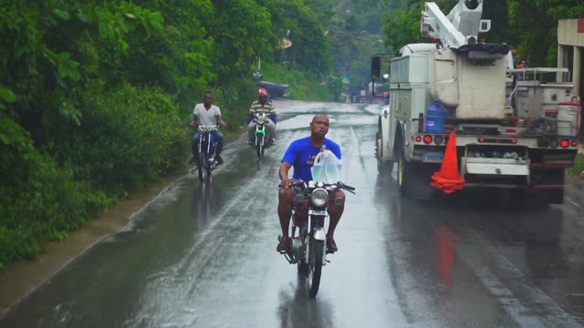 Wet Road With Motorcycle Drivers In The Pouring Rain