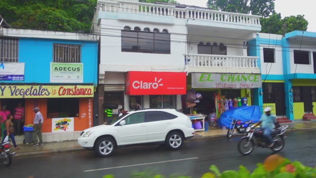 Wet Street With Shops And Signs In The Pouring Rain