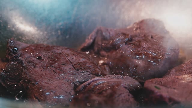 Steak Fried In An Iron Cookware