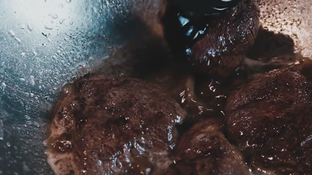 The Meat Is Cooked In A Large Deep Cookware