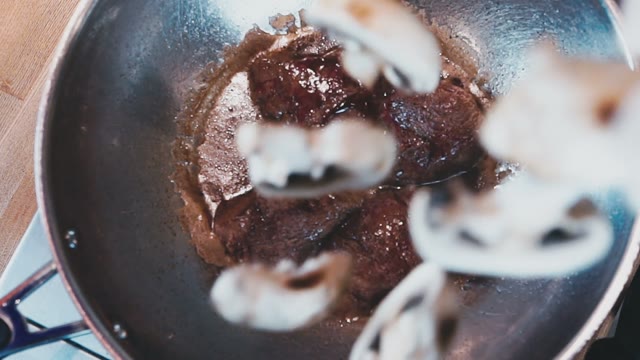 White Mushrooms Flew Into The Pan With The Meat