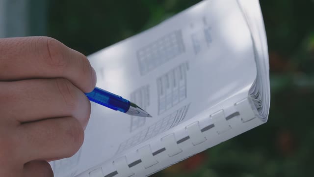 Scientist Filling Inspection Table For Tomatoes In The Greenhouse