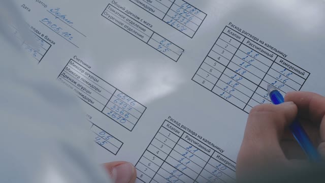 Scientist Filling Table On Care For Tomatoes