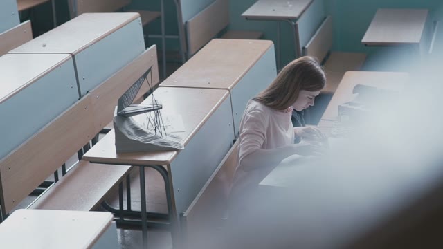 The Girl Student In A Pink Blouse Draws And Design Drawing