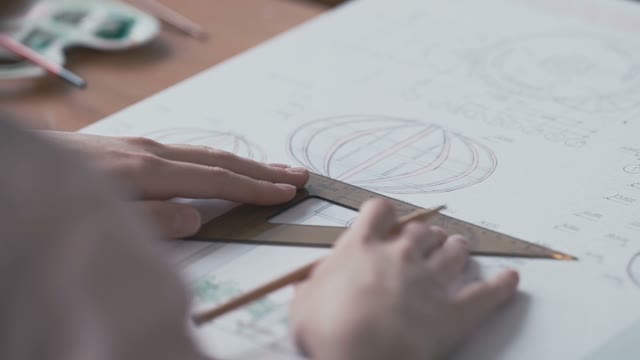 Hands Of A Young Girl Draw A Complex A Drawing