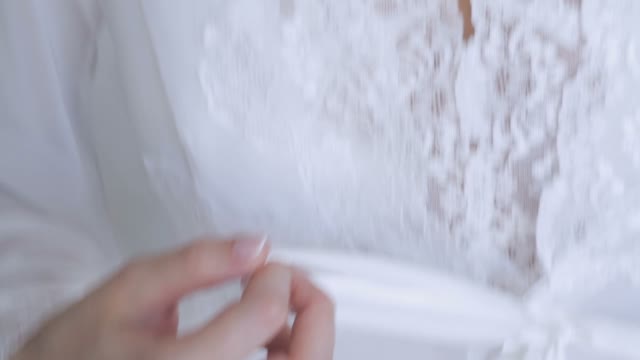 Girl In A White Robe Bow Ties Close-up