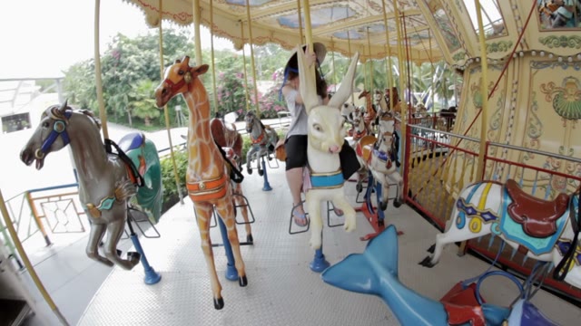 Girl Rides Carousel