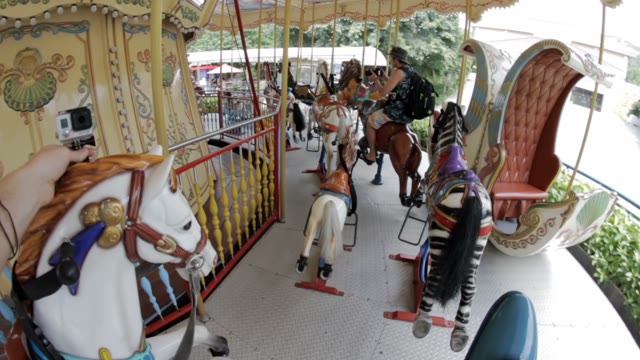 Guys Ride The Carousel And Filmed
