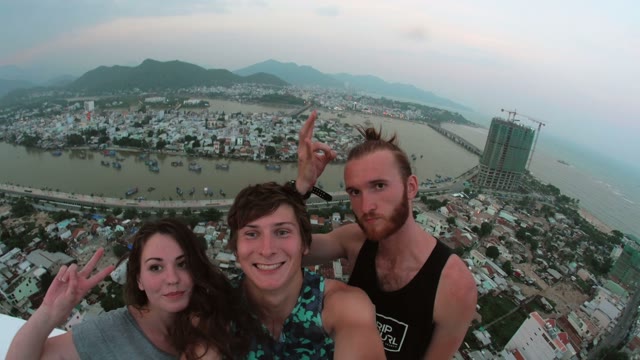 Friends Are On A Background Of Sea And Mountains