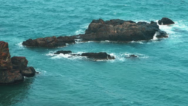 Waves Beating Against The Rocks