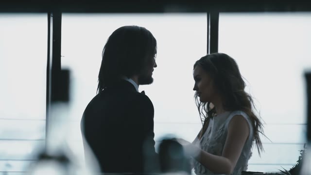 Young Bride Hugs Her Groom In Shades Blue Colors