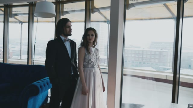 Bridal Couple Hugging By The Window