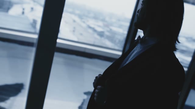 Bearded Man Standing In Front Of The Window